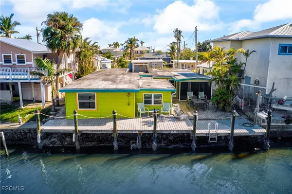 a view of a house with a garage and a chair