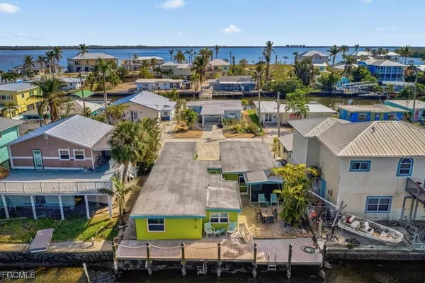 a view of multiple houses with yard