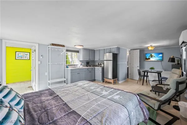 a bedroom with a bed and a table