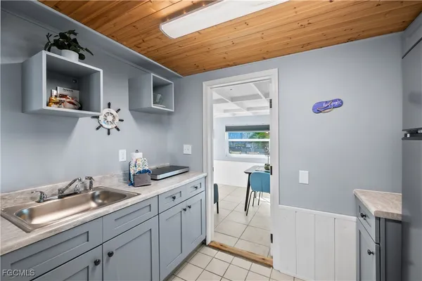 a bathroom with a sink a toilet and shower curtain