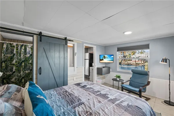 a kitchen with a refrigerator and cabinets