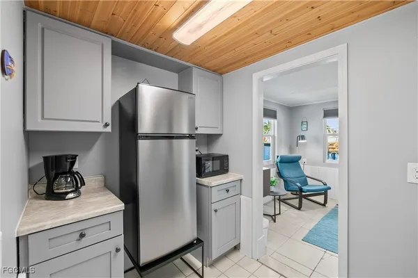 a bedroom with a bed and cabinets