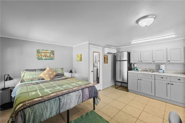 a bedroom with a bed and a bookshelf