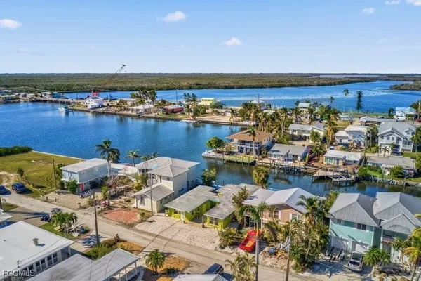 an aerial view of a house with a table and chairs
