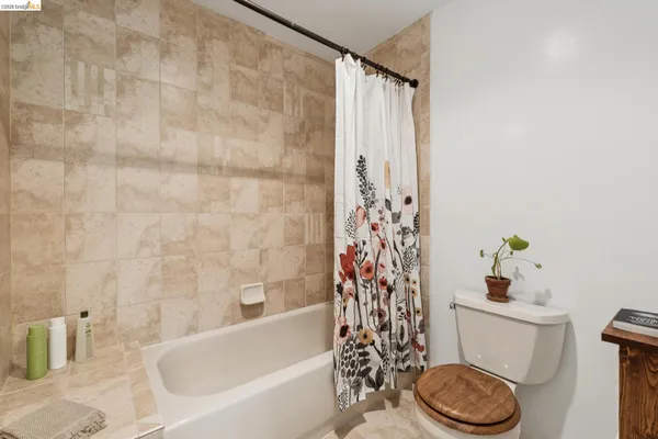 a bathroom with a sink a toilet and a bathtub