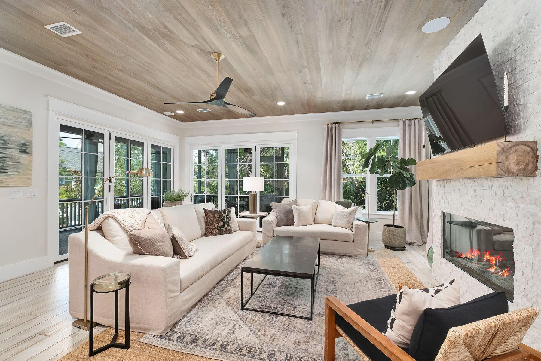 9 Bowline Alley Santa Rosa Beach, FL 32459 - Photo 14 of 52 a living room with furniture large window and a fireplace