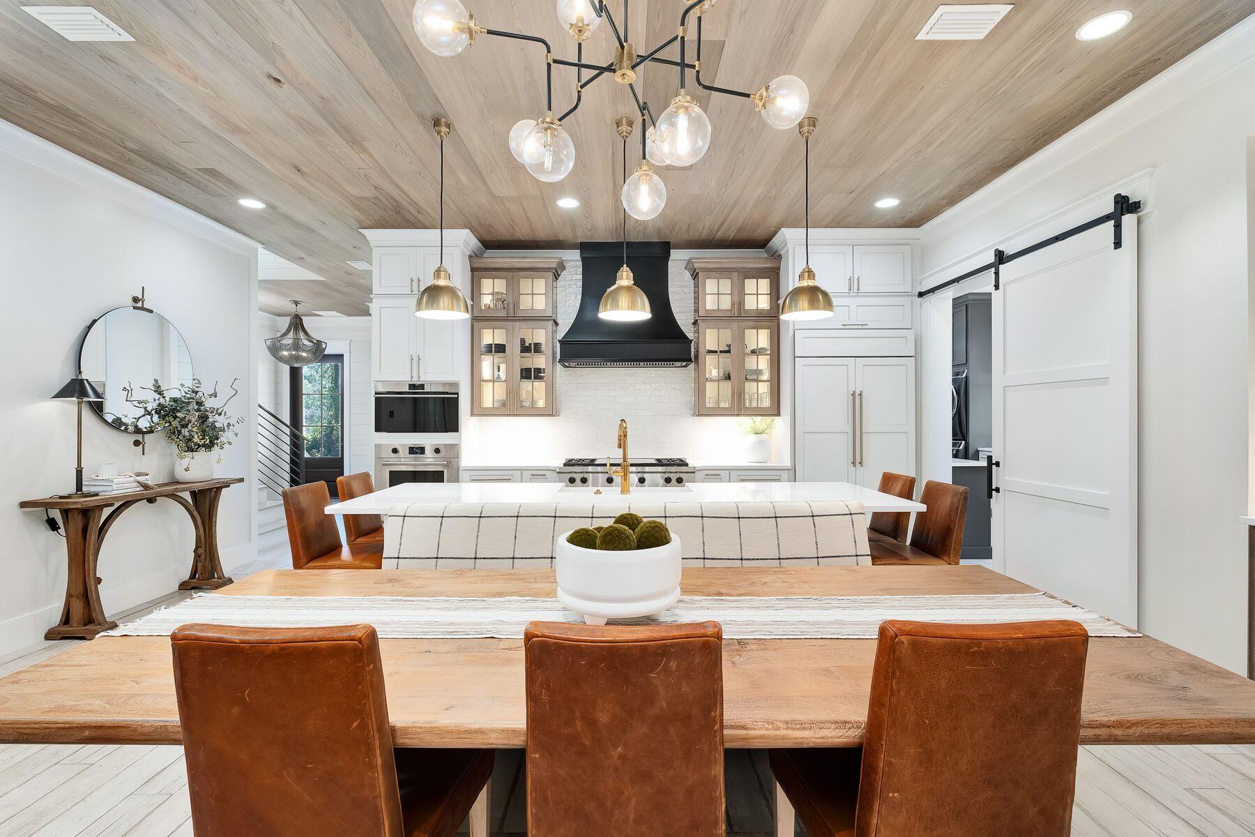 9 Bowline Alley Santa Rosa Beach, FL 32459 - Photo 17 of 52 a view of a dining room with furniture wooden floor and chandelier