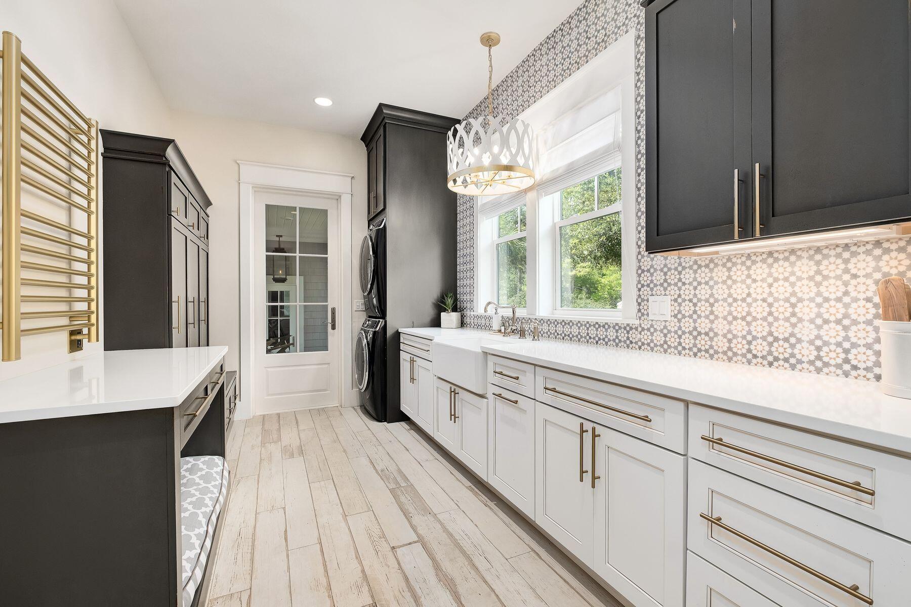 9 Bowline Alley Santa Rosa Beach, FL 32459 - Photo 24 of 52 a large white kitchen with cabinets a sink and a window