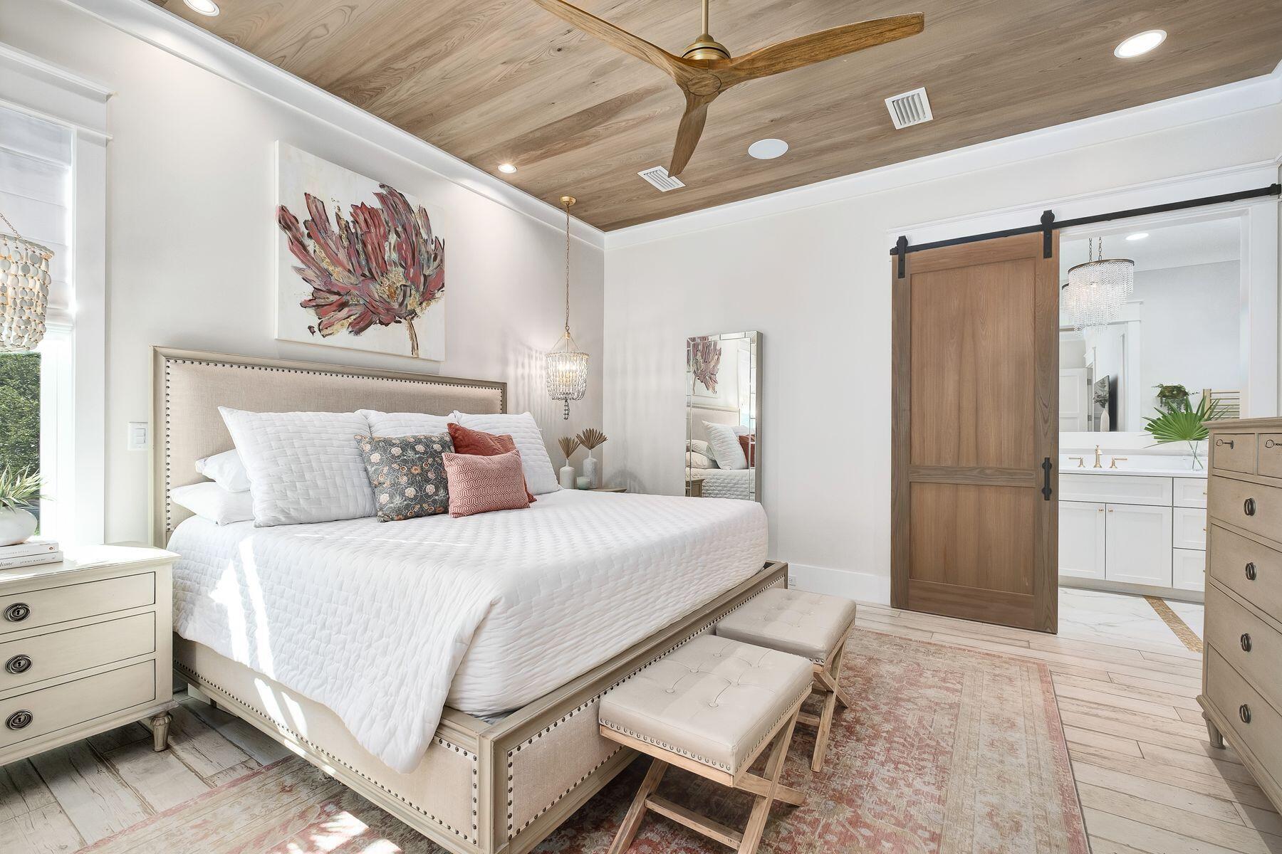 9 Bowline Alley Santa Rosa Beach, FL 32459 - Photo 25 of 52 a bedroom with a bed and a chandelier