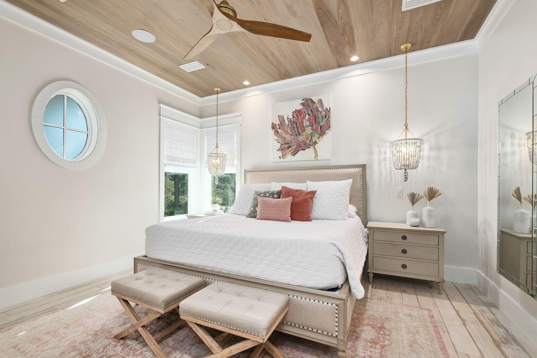 9 Bowline Alley Santa Rosa Beach, FL 32459 - Photo 26 of 52 a bedroom with a large bed and a chandelier