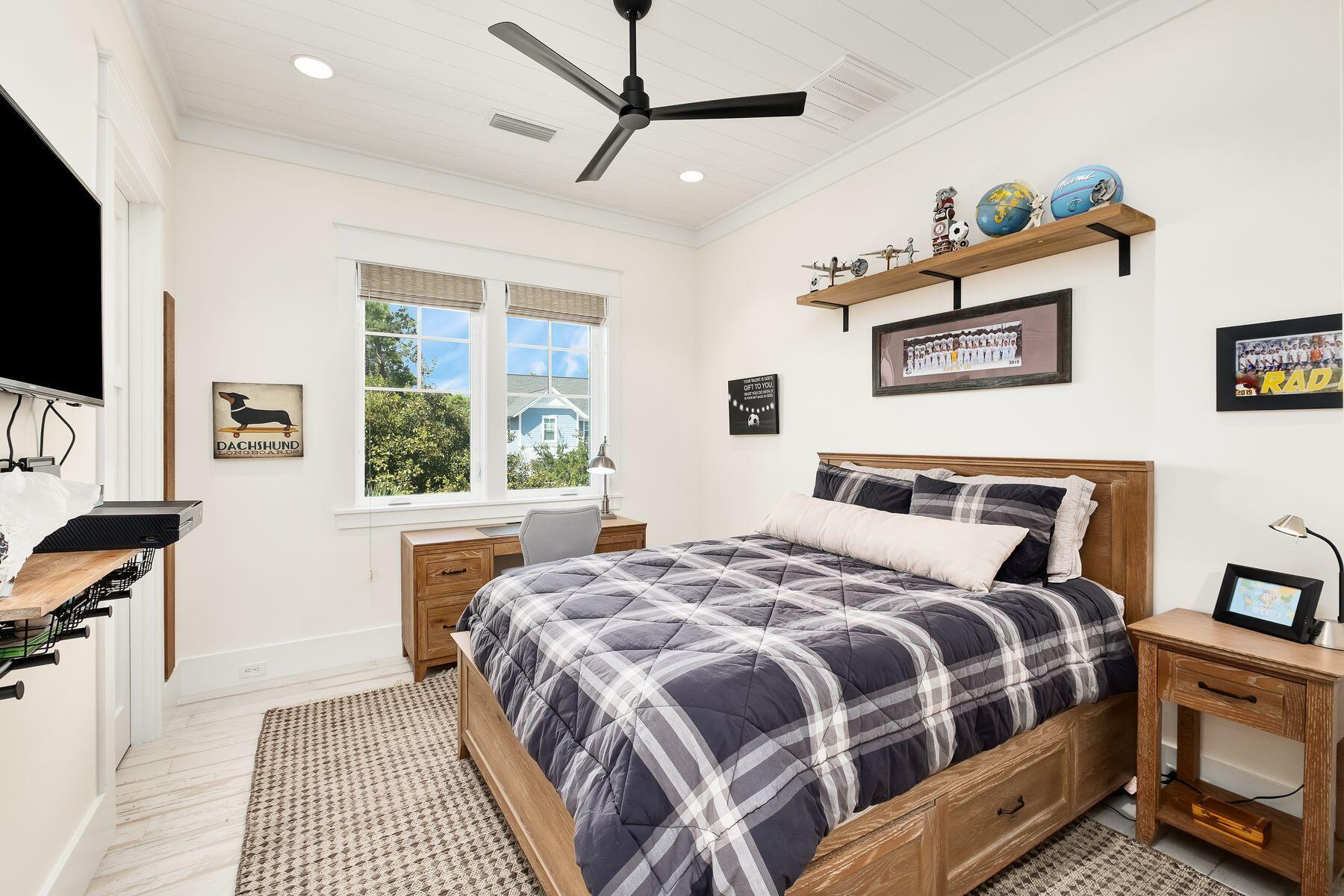9 Bowline Alley Santa Rosa Beach, FL 32459 - Photo 33 of 52 a bedroom with a bed a flat screen tv and a window