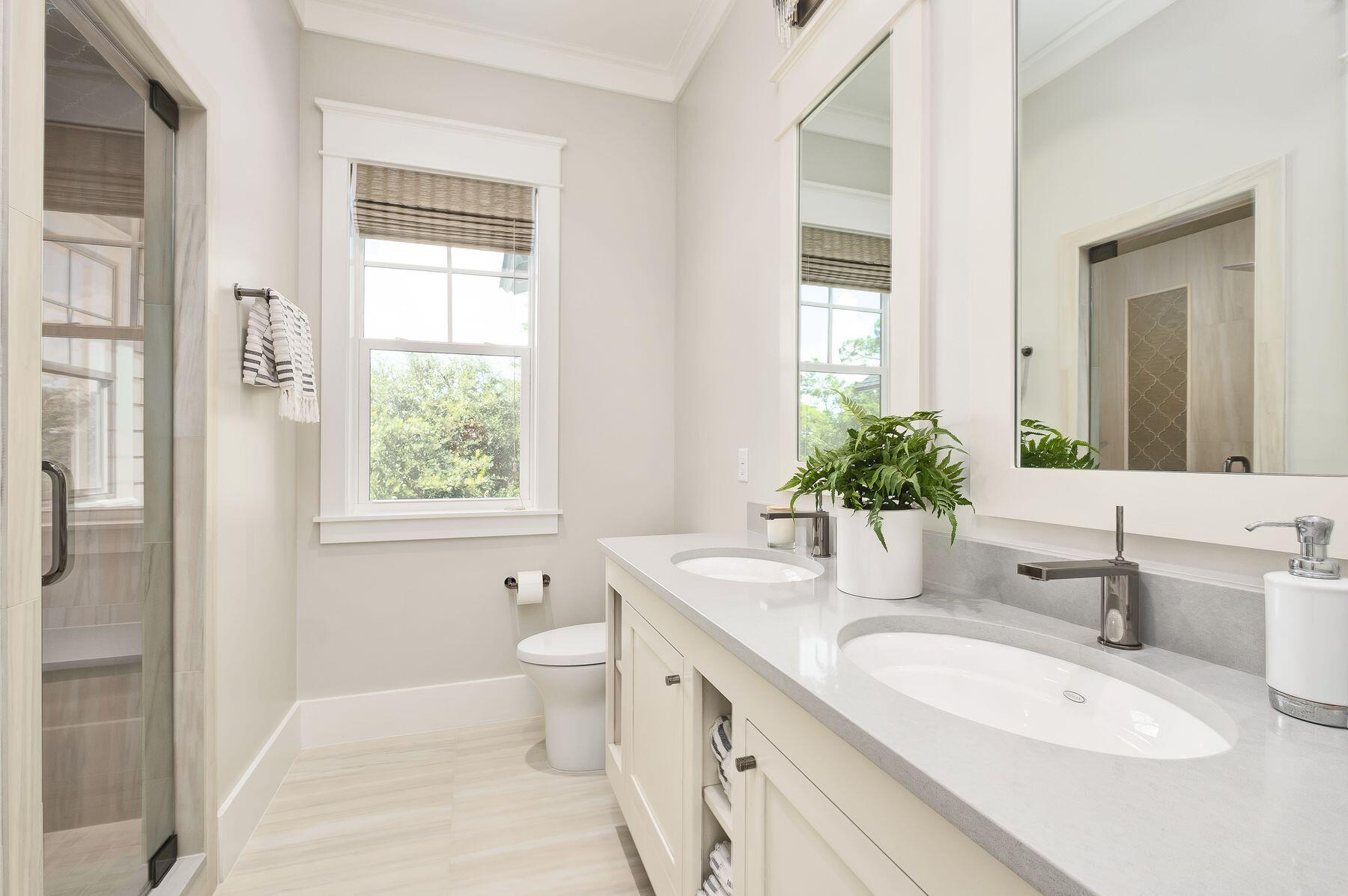 9 Bowline Alley Santa Rosa Beach, FL 32459 - Photo 39 of 52 a bathroom with a granite countertop sink toilet and large mirror
