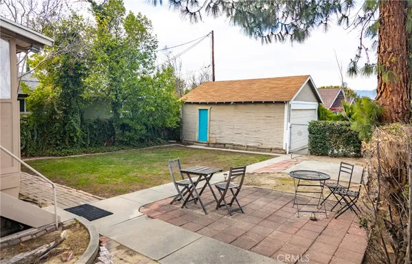 a view of a house with pool porch and chairs