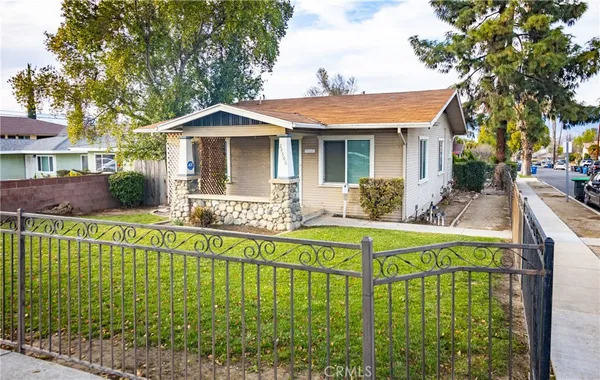 a front view of a house with a yard table and chairs