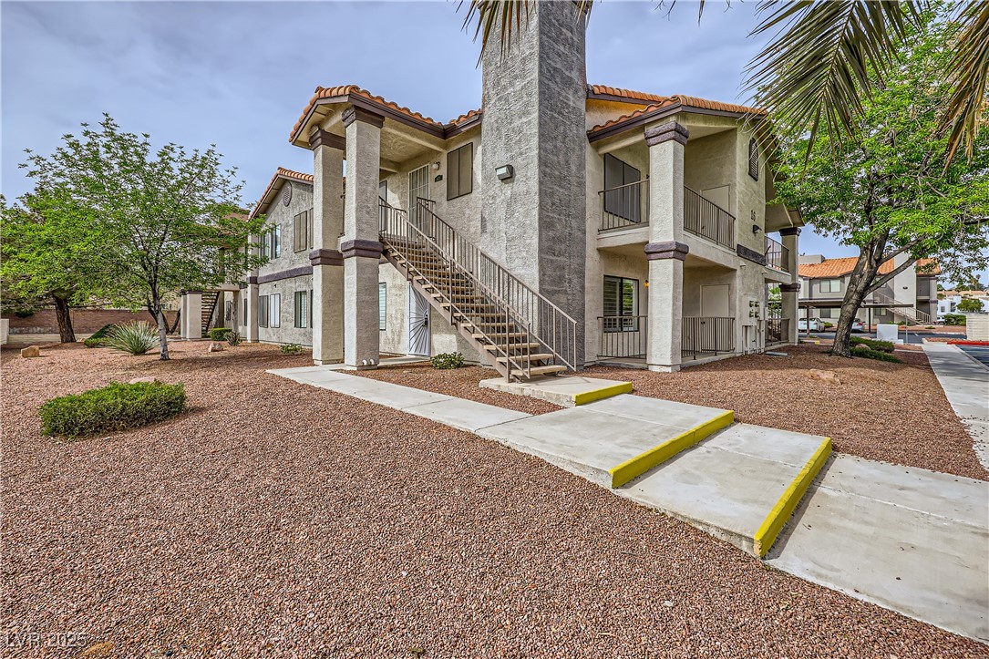 1575 West Warm Springs Road, Unit 1613 Henderson, NV 89014 - Photo 1 of 39 View of building exterior with stairway