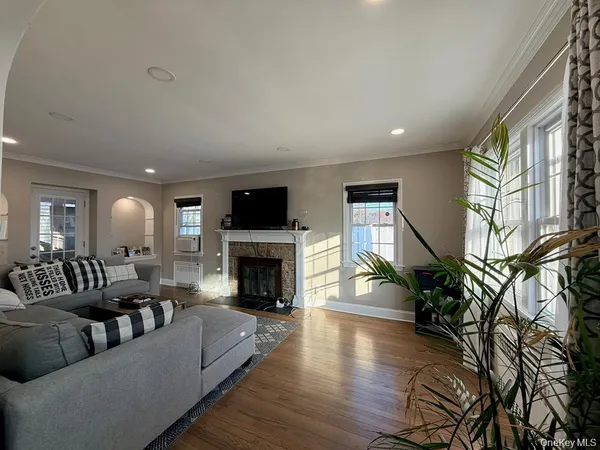 a living room with furniture or fireplace and a wooden floor