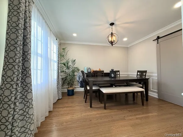 a view of a livingroom with furniture and wooden floor