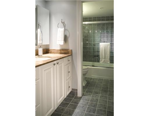 1800 South Ocean Boulevard, Unit 3C Boca Raton, FL 33432 - Photo 13 of 21 a bathroom with a granite countertop sink a mirror and a shower
