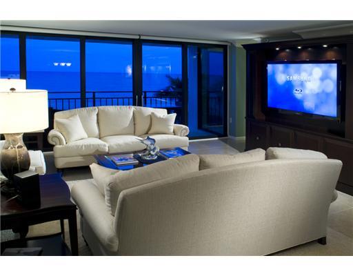 1800 South Ocean Boulevard, Unit 3C Boca Raton, FL 33432 - Photo 4 of 21 a living room with furniture and a flat screen tv