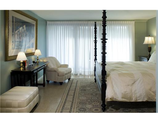1800 South Ocean Boulevard, Unit 3C Boca Raton, FL 33432 - Photo 8 of 21 a bedroom with furniture and a chandelier