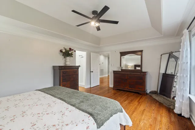 a bedroom with a bed and a dresser in it