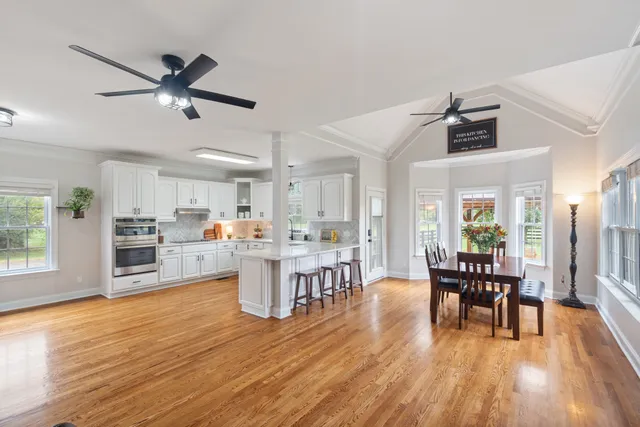a view of a dining room with furniture window and wooden floor