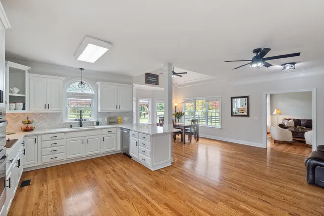a kitchen with a sink a window and stainless steel appliances