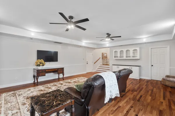 a bedroom with furniture and a window