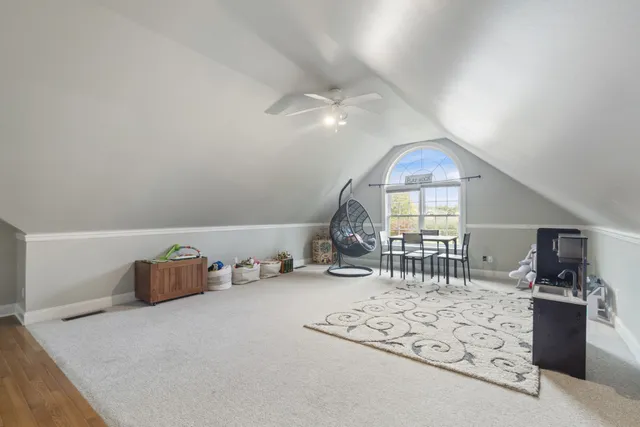 a view of an empty room with window and closet