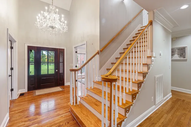 a view of entryway with wooden floor and stair
