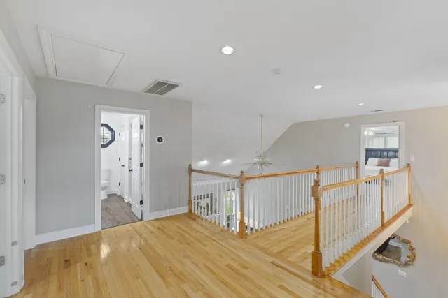 a bedroom with a bed and a ceiling fan