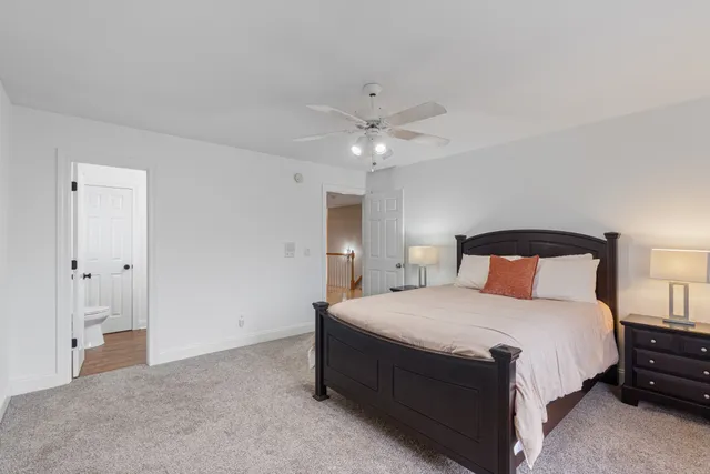 a view of a hallway with the wooden floor and staircase