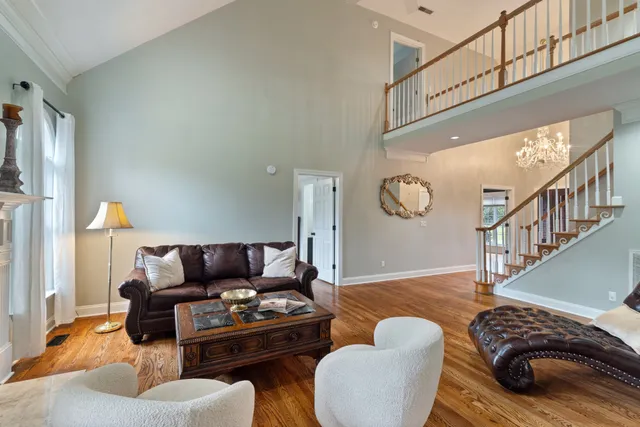 a living room with furniture and a table