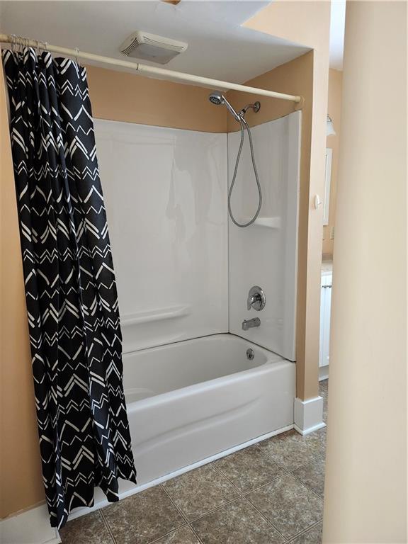 808 18th Street Ambridge, PA 15003 - Photo 16 of 49 a bathroom with a bathtub and shower