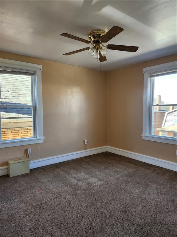 808 18th Street Ambridge, PA 15003 - Photo 18 of 49 an empty room with windows and fan