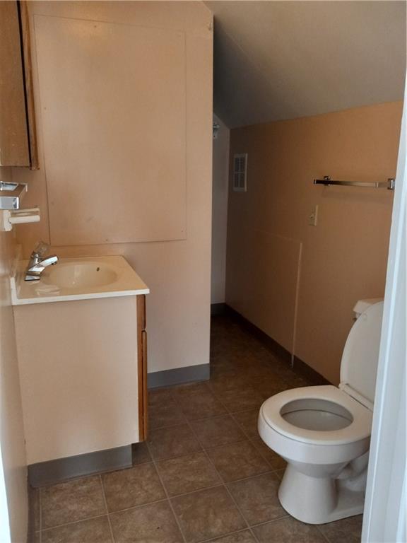 808 18th Street Ambridge, PA 15003 - Photo 31 of 49 a bathroom with a sink a toilet and a mirror