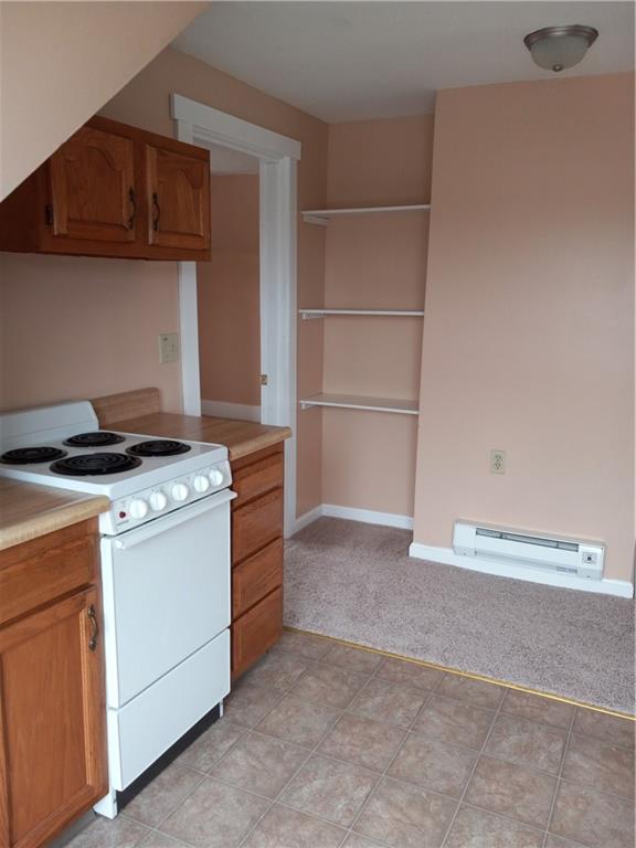 808 18th Street Ambridge, PA 15003 - Photo 34 of 49 a kitchen with a stove and a cabinets
