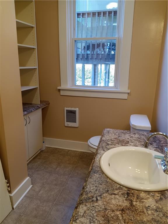 808 18th Street Ambridge, PA 15003 - Photo 4 of 49 a bathroom with a sink and a mirror