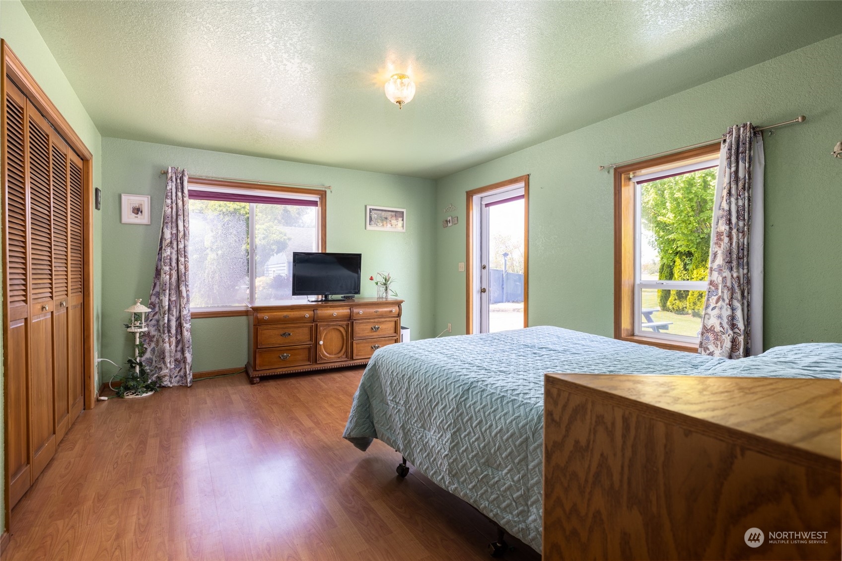 3304 South Pass Road Everson, WA 98247 - Photo 16 of 40 a bedroom with a bed and a flat screen tv