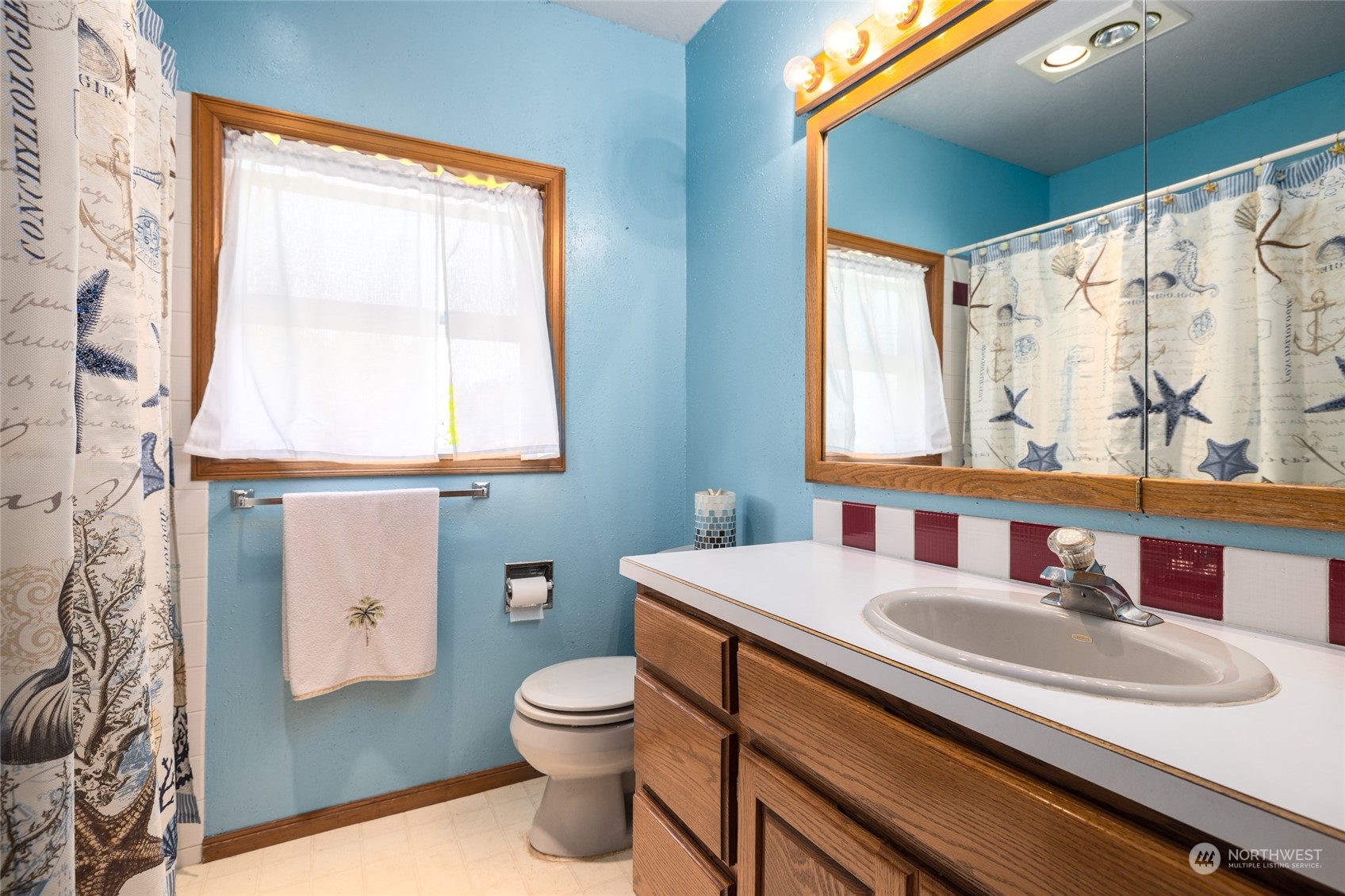 3304 South Pass Road Everson, WA 98247 - Photo 18 of 40 a bathroom with a sink toilet and mirror