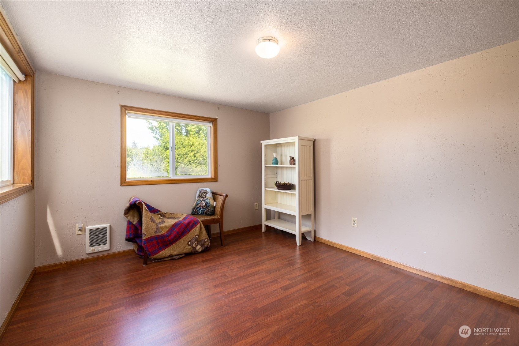 3304 South Pass Road Everson, WA 98247 - Photo 19 of 40 an empty room with wooden floor and windows