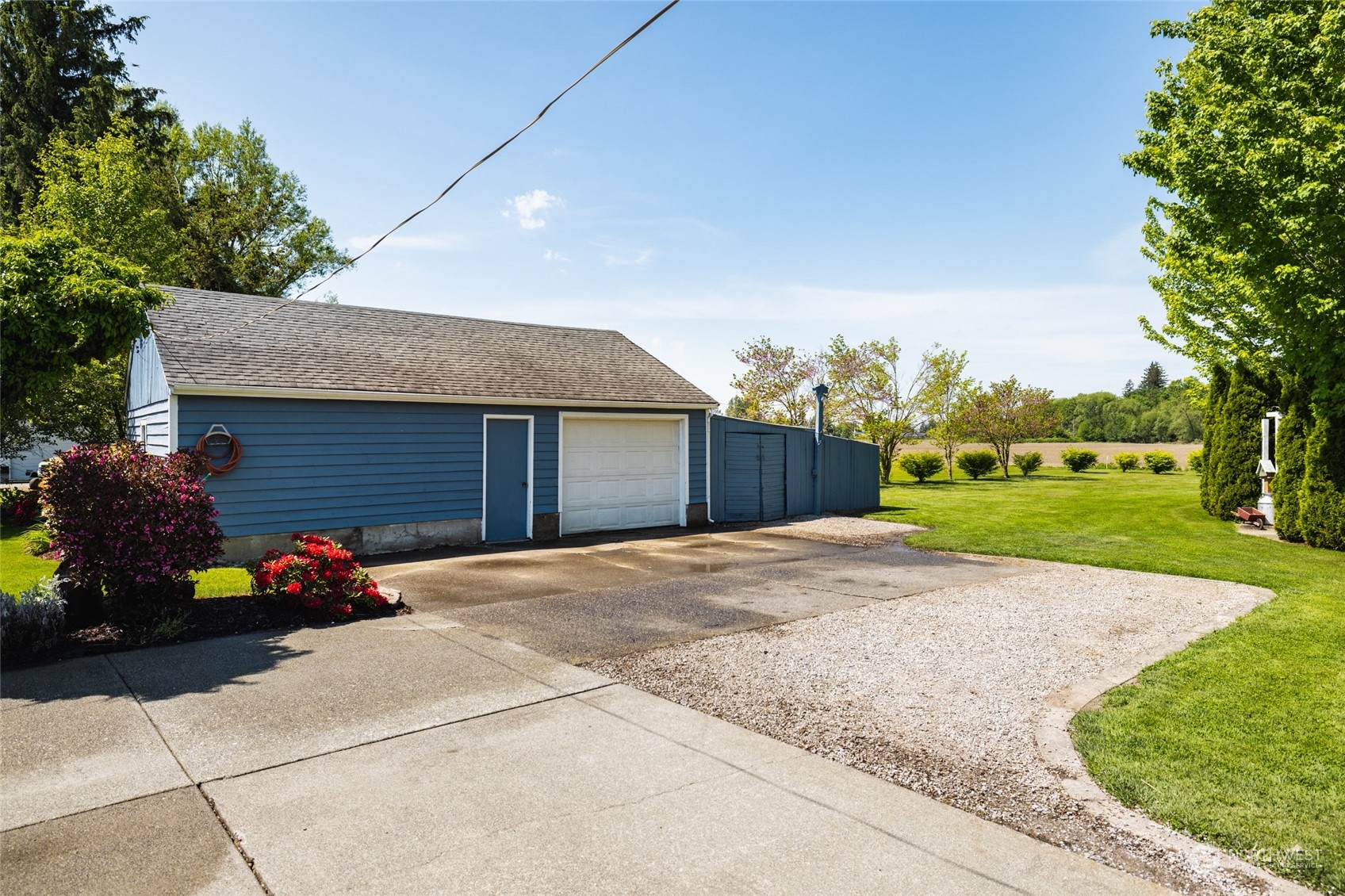 3304 South Pass Road Everson, WA 98247 - Photo 31 of 40 a front view of a house with a yard and garage