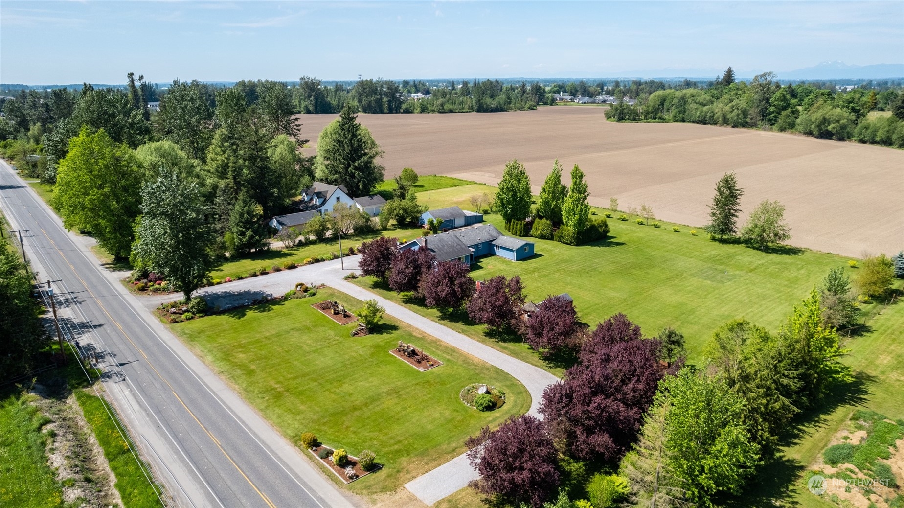 3304 South Pass Road Everson, WA 98247 - Photo 37 of 40 a view of a garden with an outdoor seating area