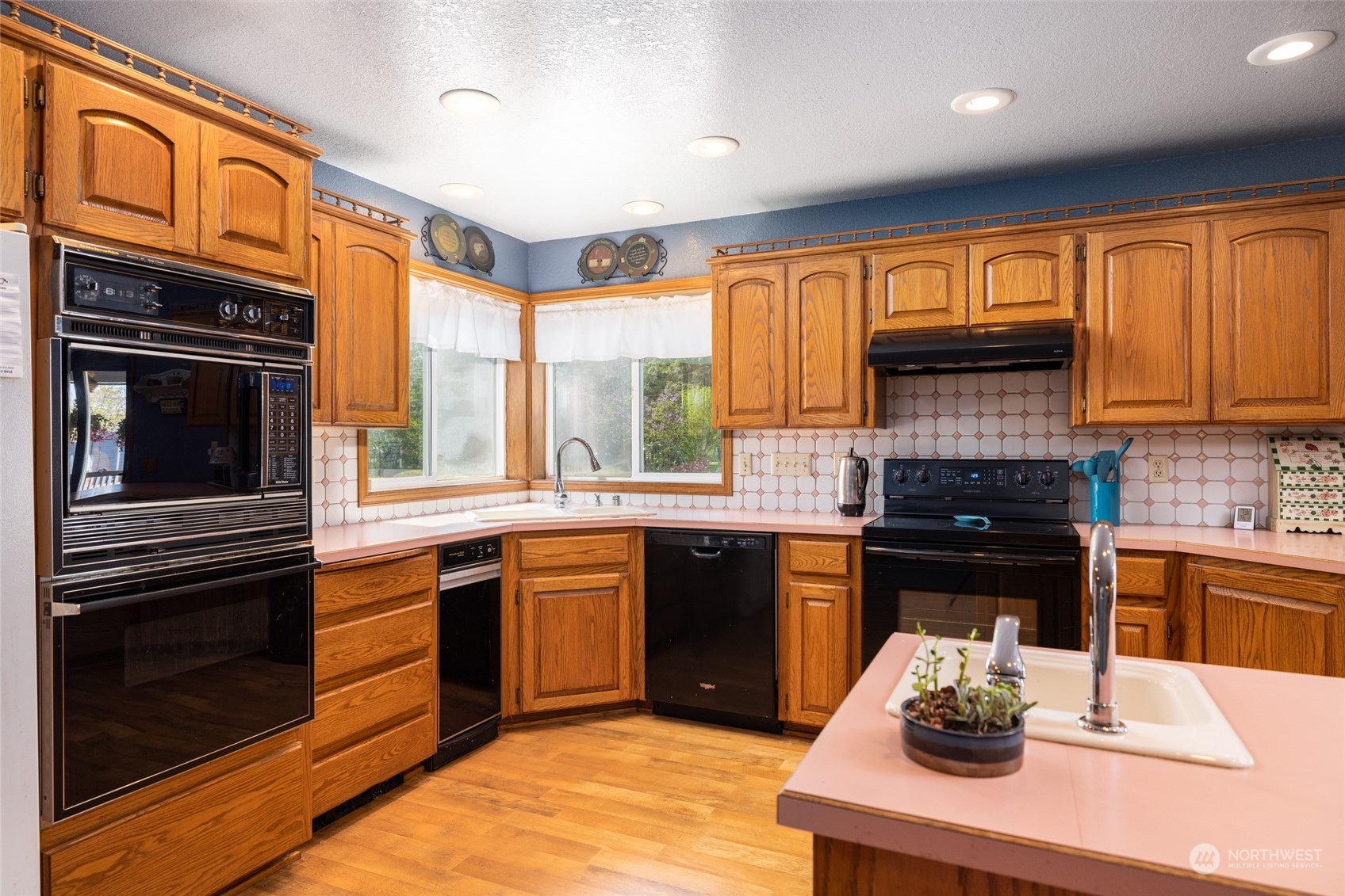 3304 South Pass Road Everson, WA 98247 - Photo 7 of 40 a kitchen with stainless steel appliances granite countertop a stove a sink and a microwave