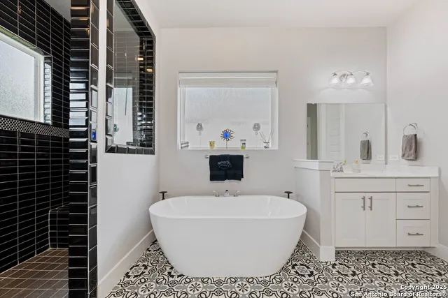 a bathroom with a bathtub and sink