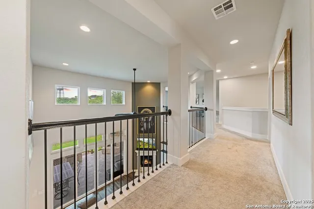 a view of a hallway with a kitchen