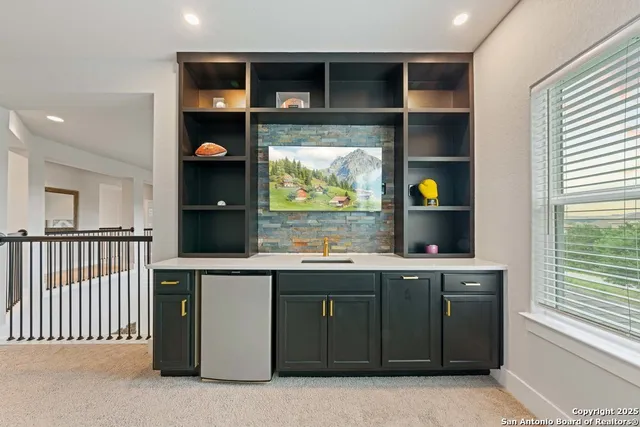 a kitchen with a cabinets and window