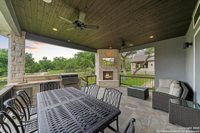 a view of a porch with furniture and a patio