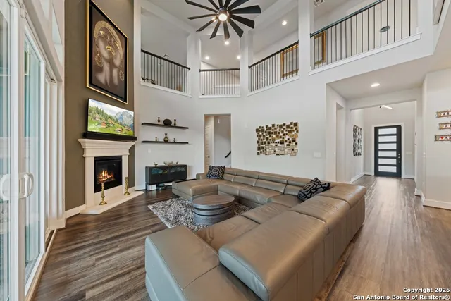 a living room with fireplace furniture and a fireplace