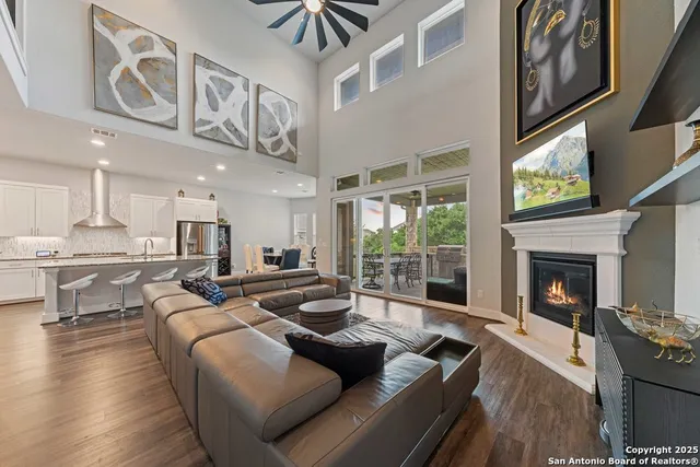 a living room with furniture and a fireplace